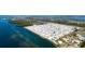 Aerial view of waterfront homes, highlighting the proximity to coastal waterways at 10315 Cortez W Rd # 8Bv, Bradenton, FL 34210