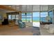 Inviting living room featuring waterfront views, lots of natural light, and comfortable seating at 10315 Cortez W Rd # 8Bv, Bradenton, FL 34210