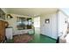The covered patio features an outdoor seating area, perfect for relaxing and enjoying the surrounding landscape at 10315 Cortez W Rd # 8Bv, Bradenton, FL 34210