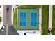 Aerial view of community pickleball courts, with blue and green playing surfaces and surrounding landscaping at 10315 Cortez W Rd # 8Bv, Bradenton, FL 34210