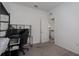 Spare bedroom with a gaming chair, desk, and the bathroom in view at 10459 Ladybug Cove, Parrish, FL 34219