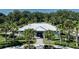 Stunning community clubhouse surrounded by lush landscaping, featuring a covered entrance and pathway, perfect for residents at 10459 Ladybug Cove, Parrish, FL 34219