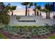 Summerwoods community sign set amongst verdant landscape with mature palm trees at 10459 Ladybug Cove, Parrish, FL 34219