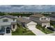 Attractive one-story home boasts verdant lawn, complemented by picturesque lake views in a desirable neighborhood at 10459 Ladybug Cove, Parrish, FL 34219