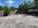 Spacious backyard with a wooden fence, potential for landscaping and outdoor activities at 110 Pine Ave, Osprey, FL 34229