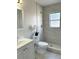 Updated bathroom with a walk-in shower, modern fixtures, and neutral tones, offering a clean and stylish design at 110 Pine Ave, Osprey, FL 34229