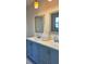 Elegant bathroom featuring a double vanity with contemporary fixtures, framed mirrors, and stylish lighting at 110 Pine Ave, Osprey, FL 34229