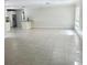 Expansive living area featuring neutral walls and tile flooring, offering a blank canvas for personalization at 110 Pine Ave, Osprey, FL 34229