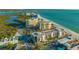 Stunning aerial view of beachfront condominiums near the ocean and bay at 1104 Benjamin Franklin Dr # 519, Sarasota, FL 34236