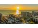 Stunning aerial view of a beachfront condo complex at sunset with direct beach access and beautiful architecture at 1104 Benjamin Franklin Dr # 519, Sarasota, FL 34236