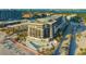 Aerial view of beachfront condo with pool, palm trees and ocean views at 1104 Benjamin Franklin Dr # 519, Sarasota, FL 34236
