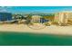 Aerial shot of beachfront condo with pool, ocean and bay views at 1104 Benjamin Franklin Dr # 519, Sarasota, FL 34236
