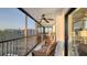 Relaxing screened balcony with comfortable seating and ceiling fan, ideal for enjoying outdoor views and fresh air at 1104 Benjamin Franklin Dr # 519, Sarasota, FL 34236