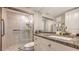 Bathroom with granite countertops, walk in shower and a white vanity at 1104 Benjamin Franklin Dr # 519, Sarasota, FL 34236