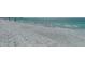 Beautiful sandy beach with turquoise ocean waters and families walking along the shore at 1104 Benjamin Franklin Dr # 519, Sarasota, FL 34236