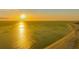 Stunning beach view with golden sunlight reflecting on the water at 1104 Benjamin Franklin Dr # 519, Sarasota, FL 34236