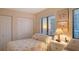 Comfortable bedroom with twin beds, bright natural light, and ample closet space at 1104 Benjamin Franklin Dr # 519, Sarasota, FL 34236