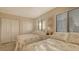 Cozy bedroom with twin beds, bright natural light, and ample closet space at 1104 Benjamin Franklin Dr # 519, Sarasota, FL 34236