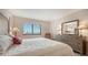 Bedroom offers a large window, plush furnishings, and ample natural light at 1104 Benjamin Franklin Dr # 519, Sarasota, FL 34236