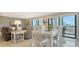 Bright dining room with comfortable seating, natural light, and serene city views at 1104 Benjamin Franklin Dr # 519, Sarasota, FL 34236