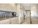 Bright kitchen featuring white cabinetry, granite countertops, and stainless steel appliances at 1104 Benjamin Franklin Dr # 519, Sarasota, FL 34236