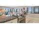 Modern kitchen boasts granite countertops, stainless steel appliances, and an open layout with a view at 1104 Benjamin Franklin Dr # 519, Sarasota, FL 34236