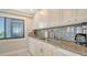 Kitchen features granite countertops, stainless steel appliances, and white cabinets for a clean, modern look at 1104 Benjamin Franklin Dr # 519, Sarasota, FL 34236