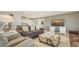 Comfortable living space featuring plush seating, a large TV, and easy access to the kitchen and dining area at 1104 Benjamin Franklin Dr # 519, Sarasota, FL 34236