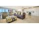 Stylish living room with designer furniture, large windows, and plenty of natural light at 1104 Benjamin Franklin Dr # 519, Sarasota, FL 34236