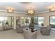 Comfortable lounge area features neutral tones, plenty of natural light, and cozy seating arrangements at 1104 Benjamin Franklin Dr # 519, Sarasota, FL 34236