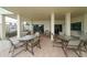 Outdoor patio space with tables and chairs, perfect for relaxing and enjoying outdoor scenery at 1104 Benjamin Franklin Dr # 519, Sarasota, FL 34236