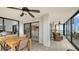 Spacious enclosed patio with tile floors, ceiling fans, and balcony access at 1104 Benjamin Franklin Dr # 519, Sarasota, FL 34236