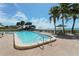 Beautiful outdoor pool with beach views, surrounded by lounge chairs and sun umbrellas at 1104 Benjamin Franklin Dr # 519, Sarasota, FL 34236