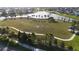 Aerial view showcases community soccer field, lake, walking paths, and gazebo at 11252 Fieldstone Dr, Palmetto, FL 34221