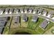 Real estate aerial shot shows neighborhood homes with fenced yards and pond access at 11252 Fieldstone Dr, Palmetto, FL 34221