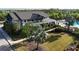 Community clubhouse aerial view features a pool, palm trees, and manicured landscaping at 11252 Fieldstone Dr, Palmetto, FL 34221