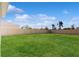 Large grassy backyard enclosed with a light-colored fence providing privacy at 11252 Fieldstone Dr, Palmetto, FL 34221