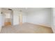 Expansive bonus room featuring neutral carpeting and access to the ensuite bathroom at 11252 Fieldstone Dr, Palmetto, FL 34221