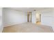Large bonus room featuring carpeted floors and multiple entryways, perfect for entertaining or relaxation at 11252 Fieldstone Dr, Palmetto, FL 34221