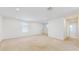 Spacious bonus room with carpeted floors and multiple windows, perfect for entertaining or relaxation at 11252 Fieldstone Dr, Palmetto, FL 34221