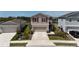Charming two-story home featuring red shutters, neutral paint, and a spacious two-car garage at 11252 Fieldstone Dr, Palmetto, FL 34221
