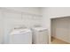 Well-equipped laundry room with modern appliances and shelving for storage at 11252 Fieldstone Dr, Palmetto, FL 34221