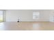 Spacious living room with tile flooring, large windows, and sliding glass door access at 11252 Fieldstone Dr, Palmetto, FL 34221
