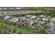 Beautiful aerial view of homes with screened pools surrounded by well-maintained lawns and mature trees in a quiet neighborhood at 11420 Golden Bay Pl, Bradenton, FL 34211