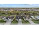 An aerial view of a well-maintained residential neighborhood featuring nicely landscaped homes and green areas at 11420 Golden Bay Pl, Bradenton, FL 34211