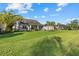 Beautiful backyard featuring well-maintained lawn and mature landscaping, creating a private oasis at 11420 Golden Bay Pl, Bradenton, FL 34211