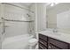 Cozy bathroom featuring shower over tub and dark wood vanity at 11420 Golden Bay Pl, Bradenton, FL 34211