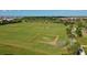 Expansive community park features a baseball diamond and soccer fields, with homes visible in the distance at 11420 Golden Bay Pl, Bradenton, FL 34211