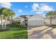 Charming single-story home with a well-manicured lawn and paver driveway at 11420 Golden Bay Pl, Bradenton, FL 34211