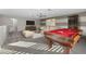 Spacious game room with a pool table, sofa, and entertainment area provides a fun and relaxing space at 11420 Golden Bay Pl, Bradenton, FL 34211